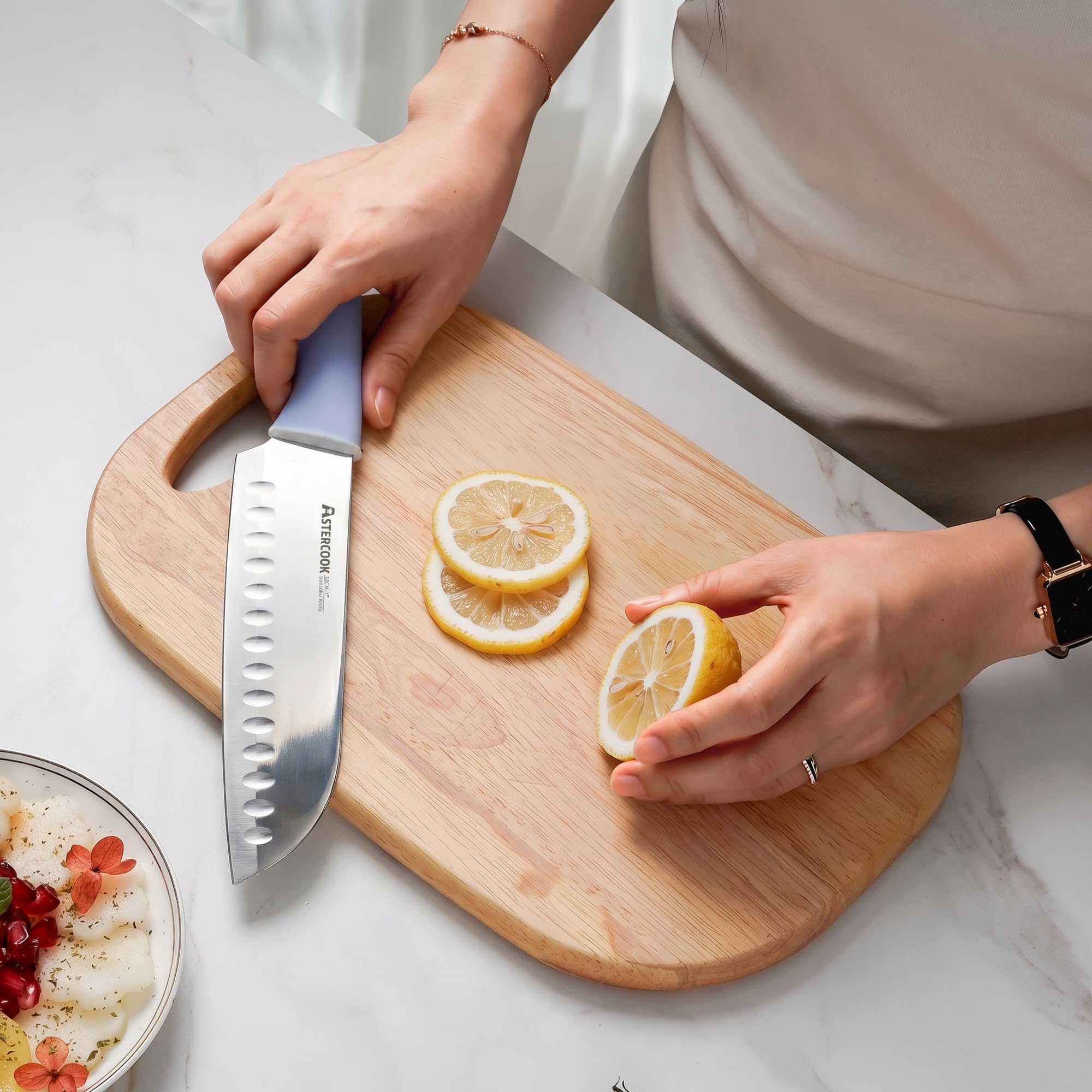 Astercook serrated bread knife slicing loaf cleanly to show precise cutting benefit