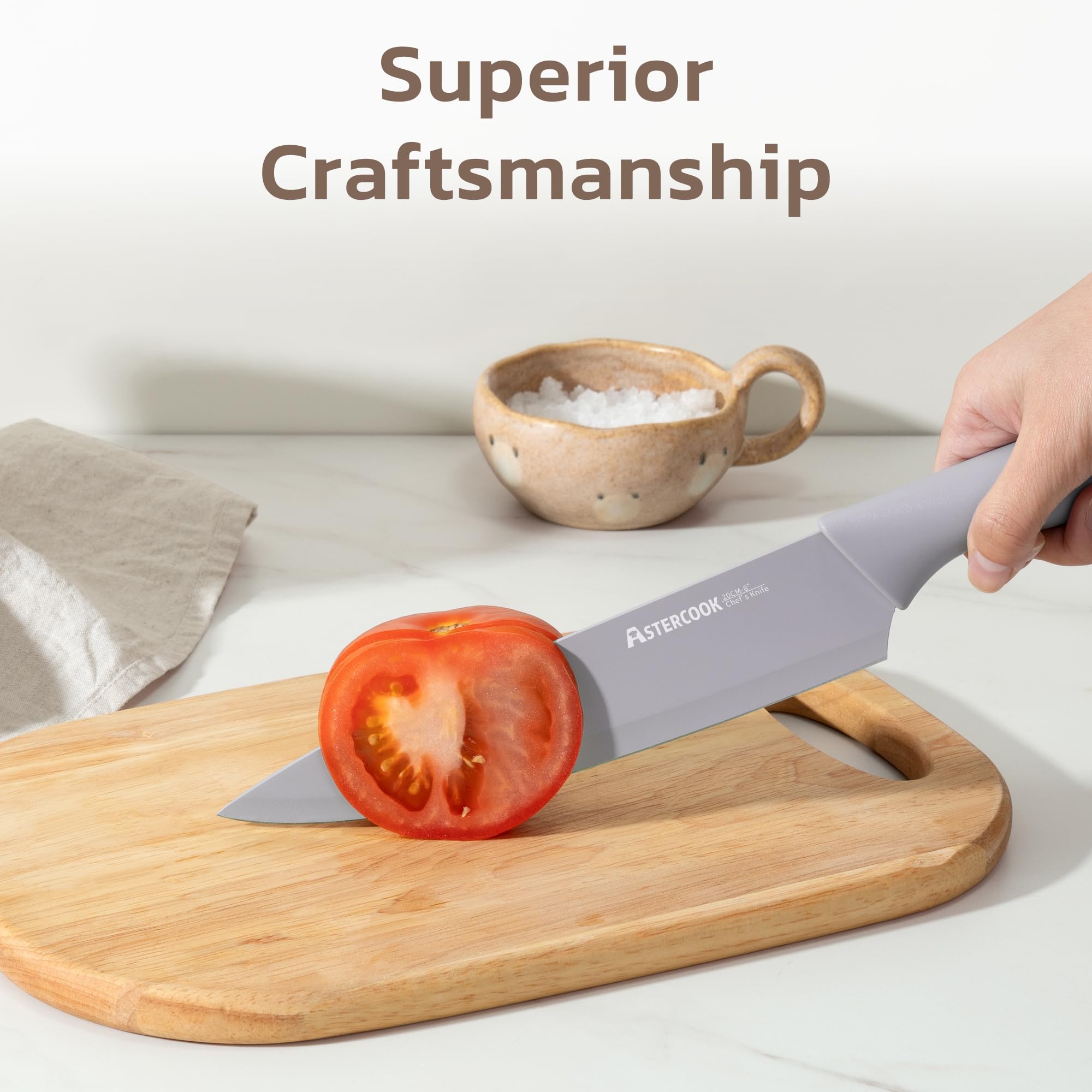 Astercook knives beside a hand for size comparison and scale