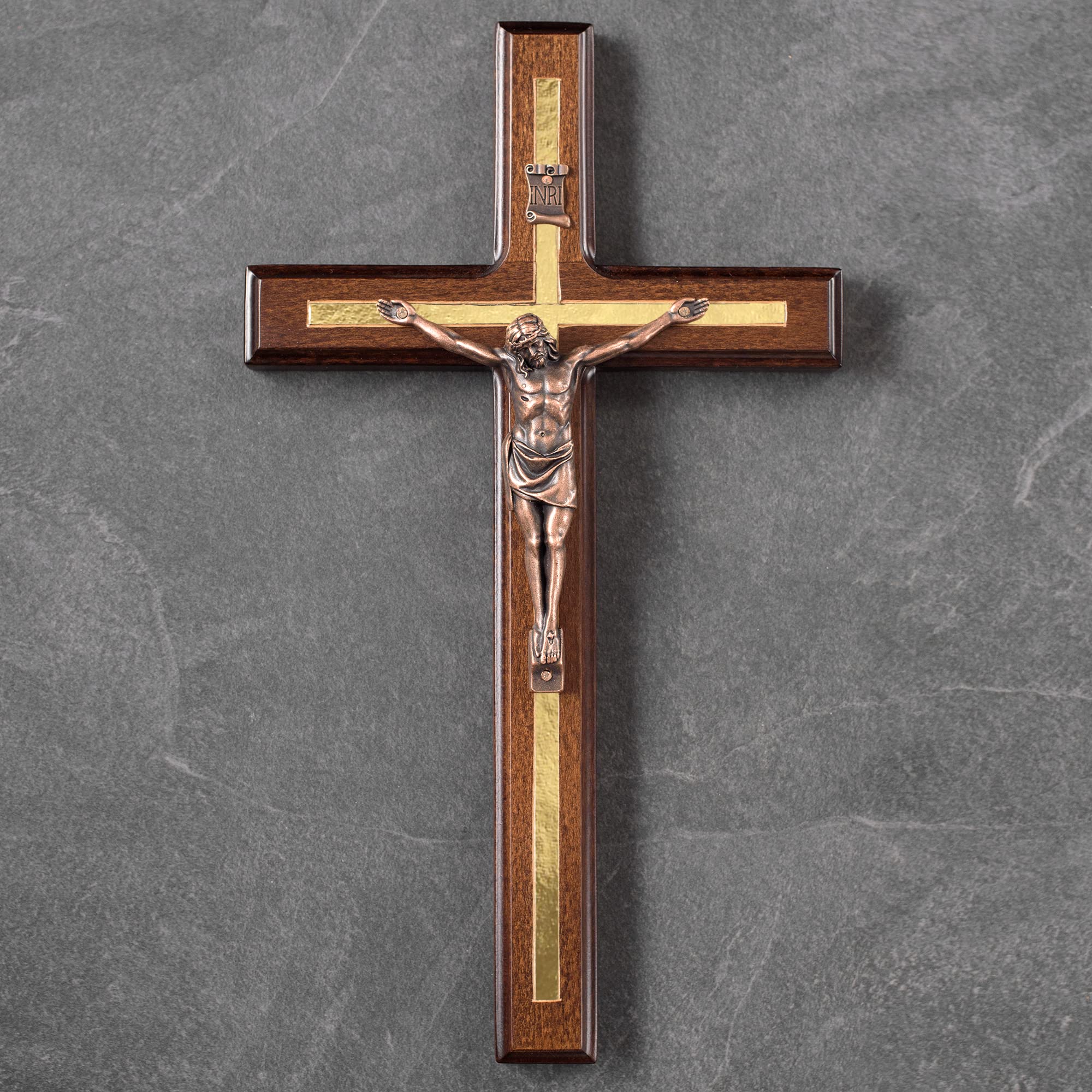 Asterom wooden rosary beside cross showing included prayer accessory