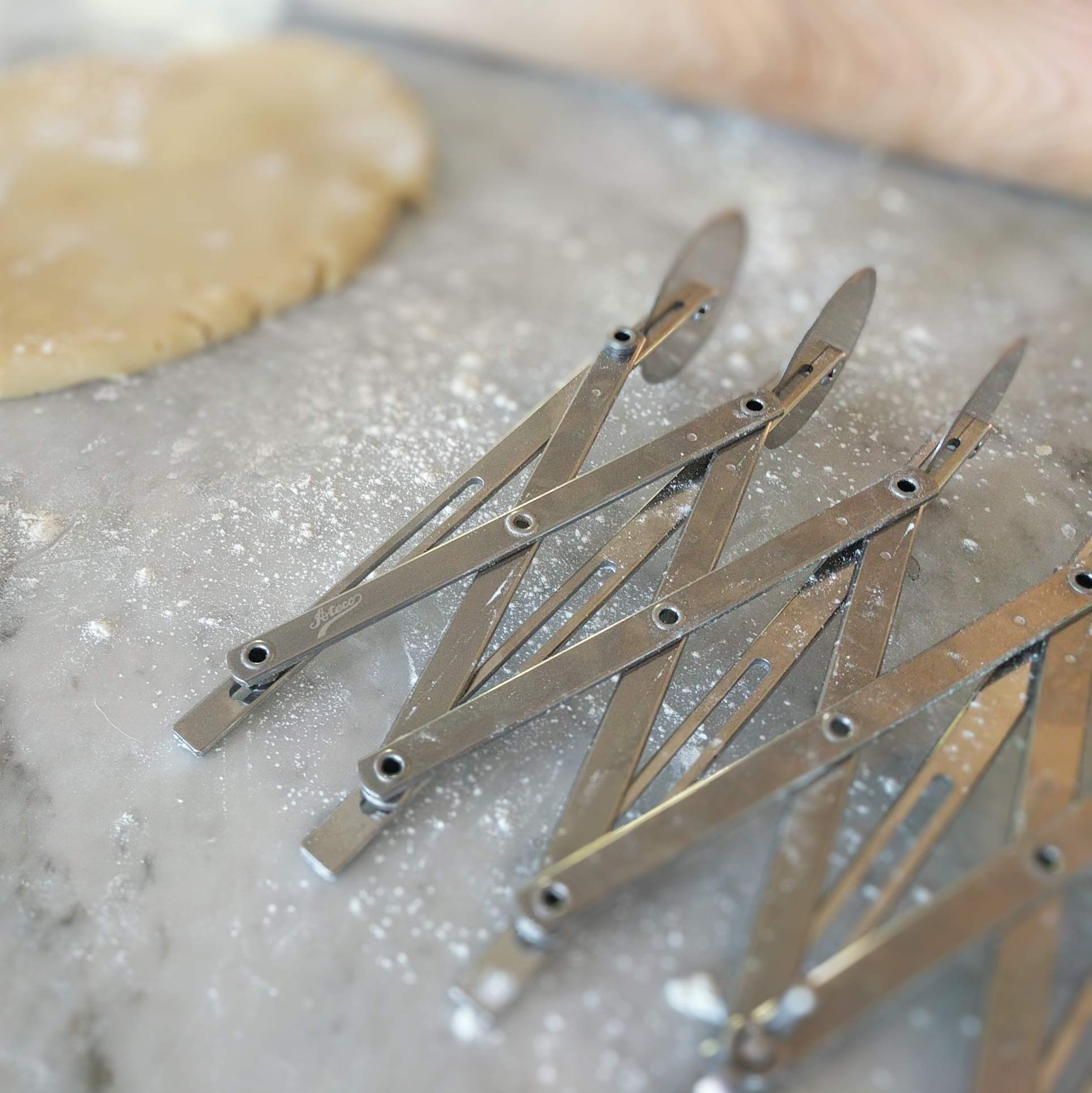 Ateco cutter in use slicing an entire brownie sheet for uniform portions quickly