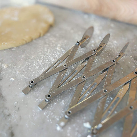 Ateco cutter in use slicing an entire brownie sheet for uniform portions quickly