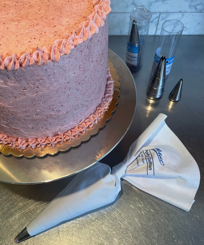 Ateco size comparison with a tiered cake showing 12-inch work area benefit
