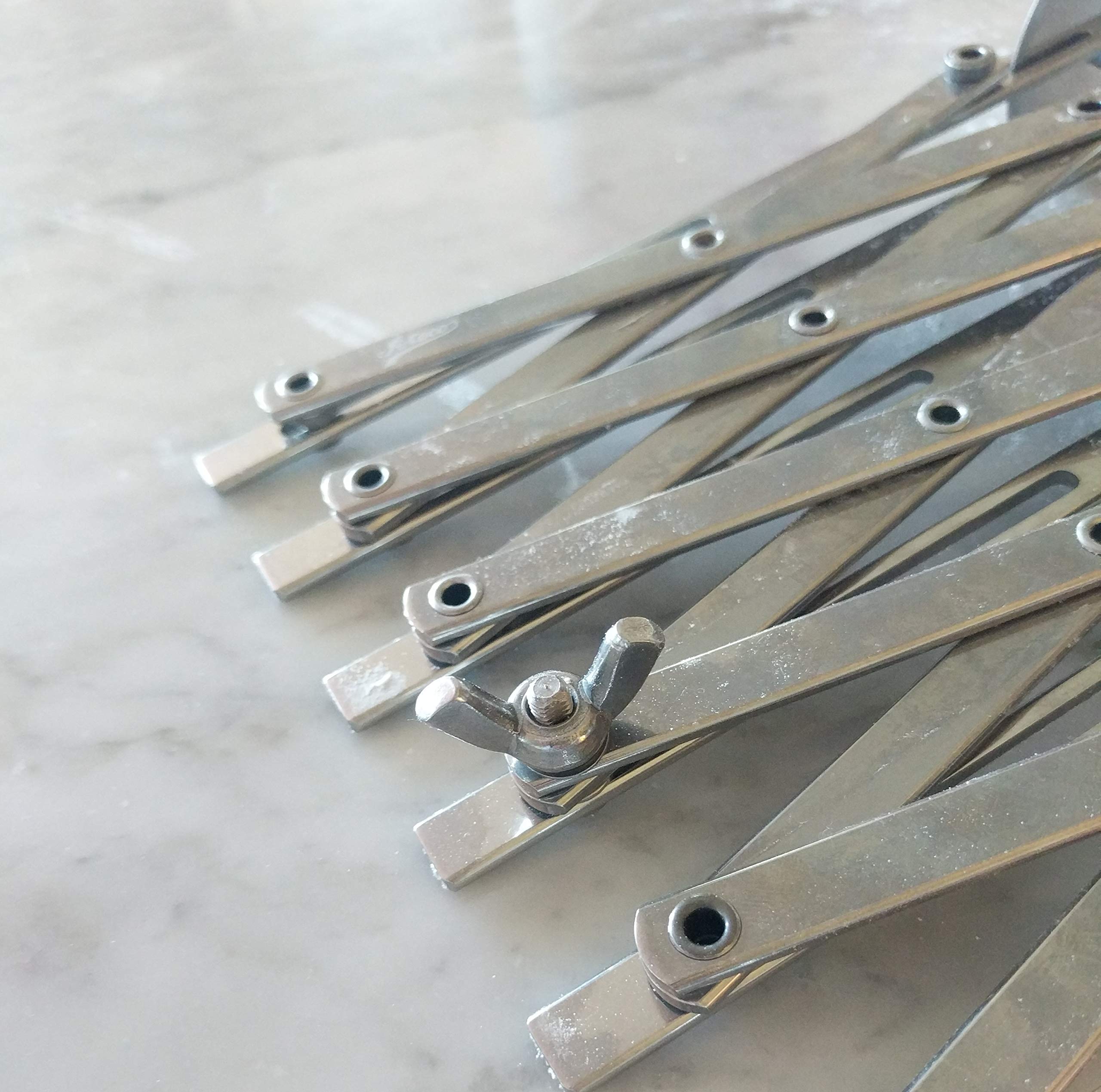 Ateco cutter beside a ruler showing 2 1/8" wheel diameter and scale accuracy