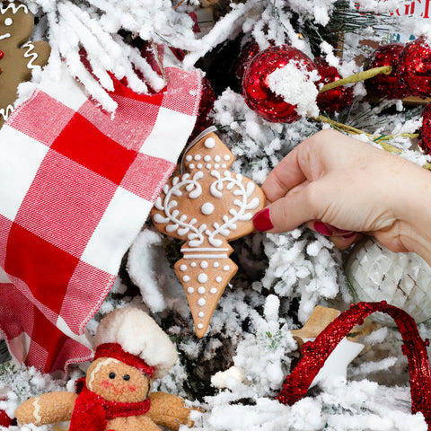 AuldHome Design ornament in hand shows 4–5 inch size for scale and visibility