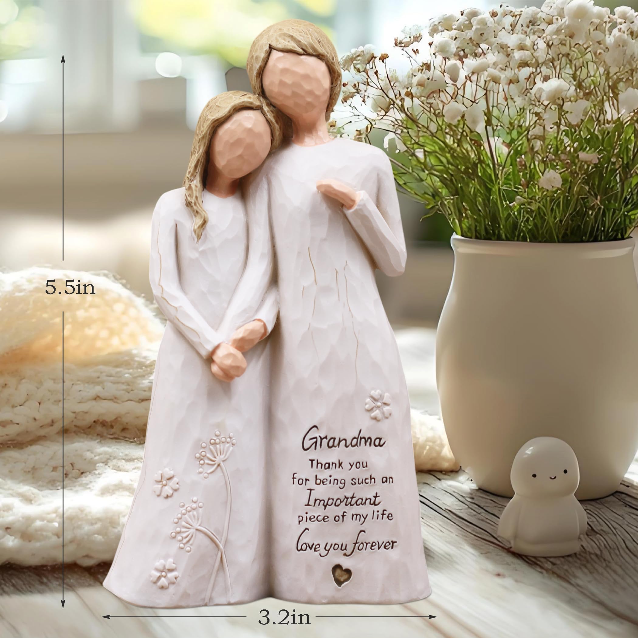 AUMELO figurine held in hand for scale to show compact 5.5-inch size and shelf-friendly benefit