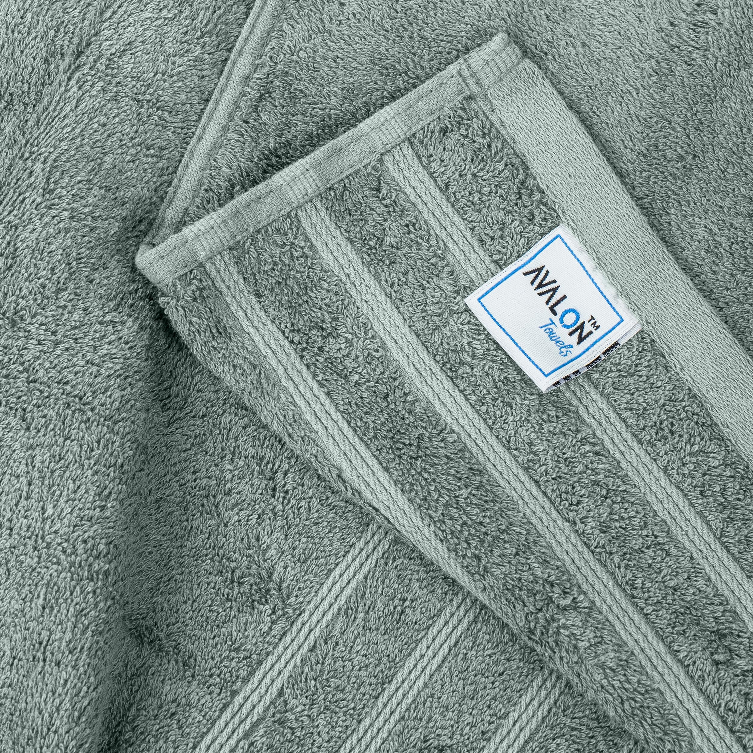 Avalon Towels neatly folded stack in bathroom showing tidy storage benefit