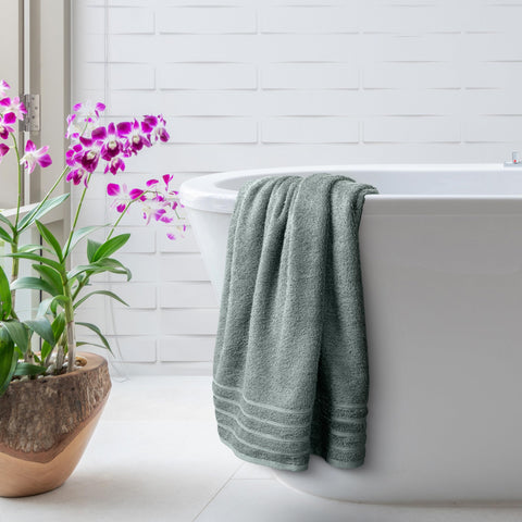 Avalon Towels hanging on towel bar showing fast-drying advantage