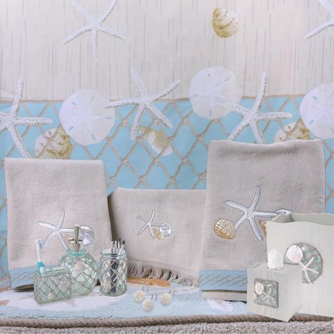Avanti Linens jar styled on bathroom counter demonstrating tidy storage and coastal decor