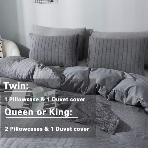 AveLom styled bedroom with gray seersucker duvet showcasing modern relaxed bedding vibe