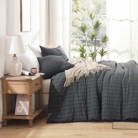 AveLom styled bedroom with comforter portraying contemporary decor and inviting atmosphere