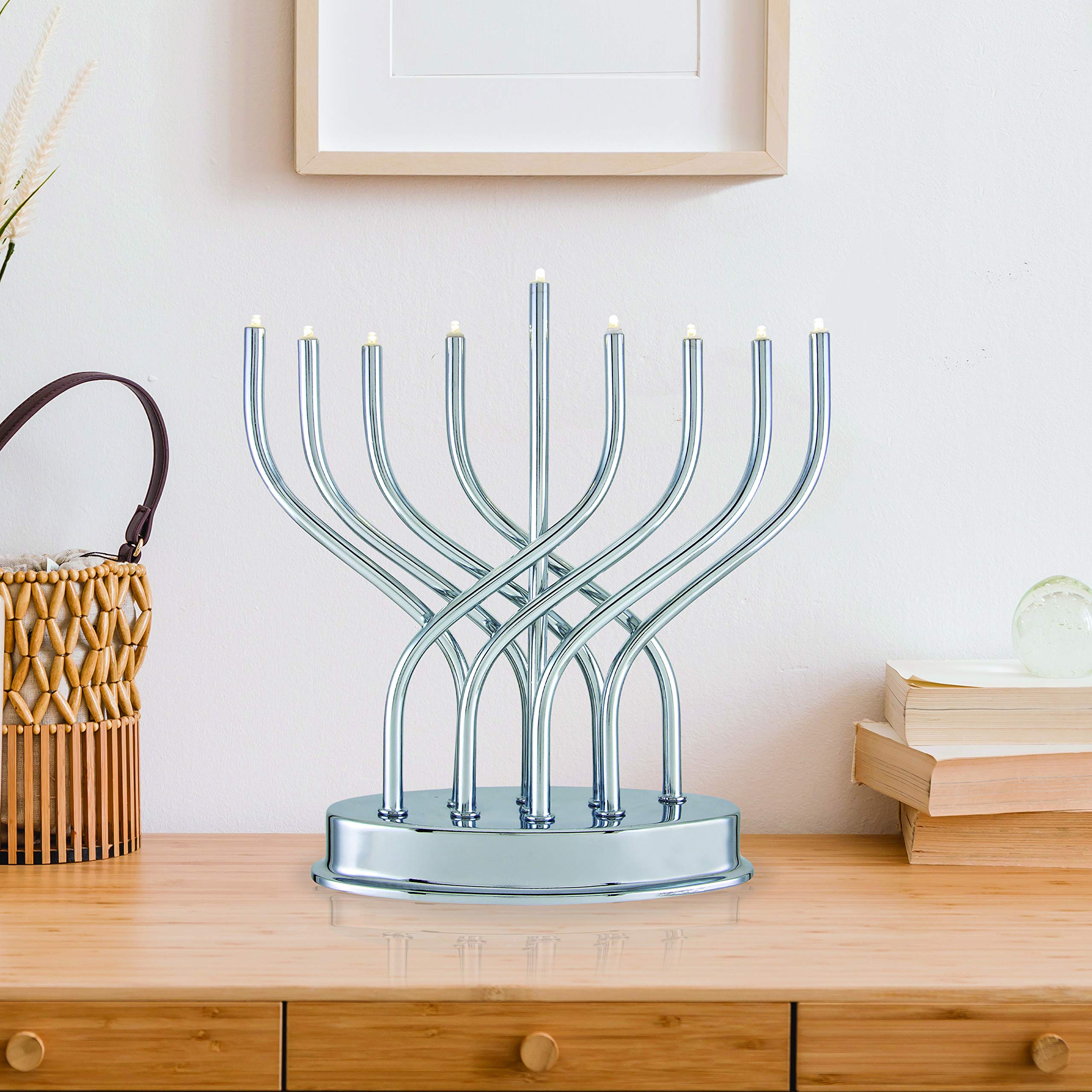 Aviv Judaica menorah held to show scale and compactness for small spaces
