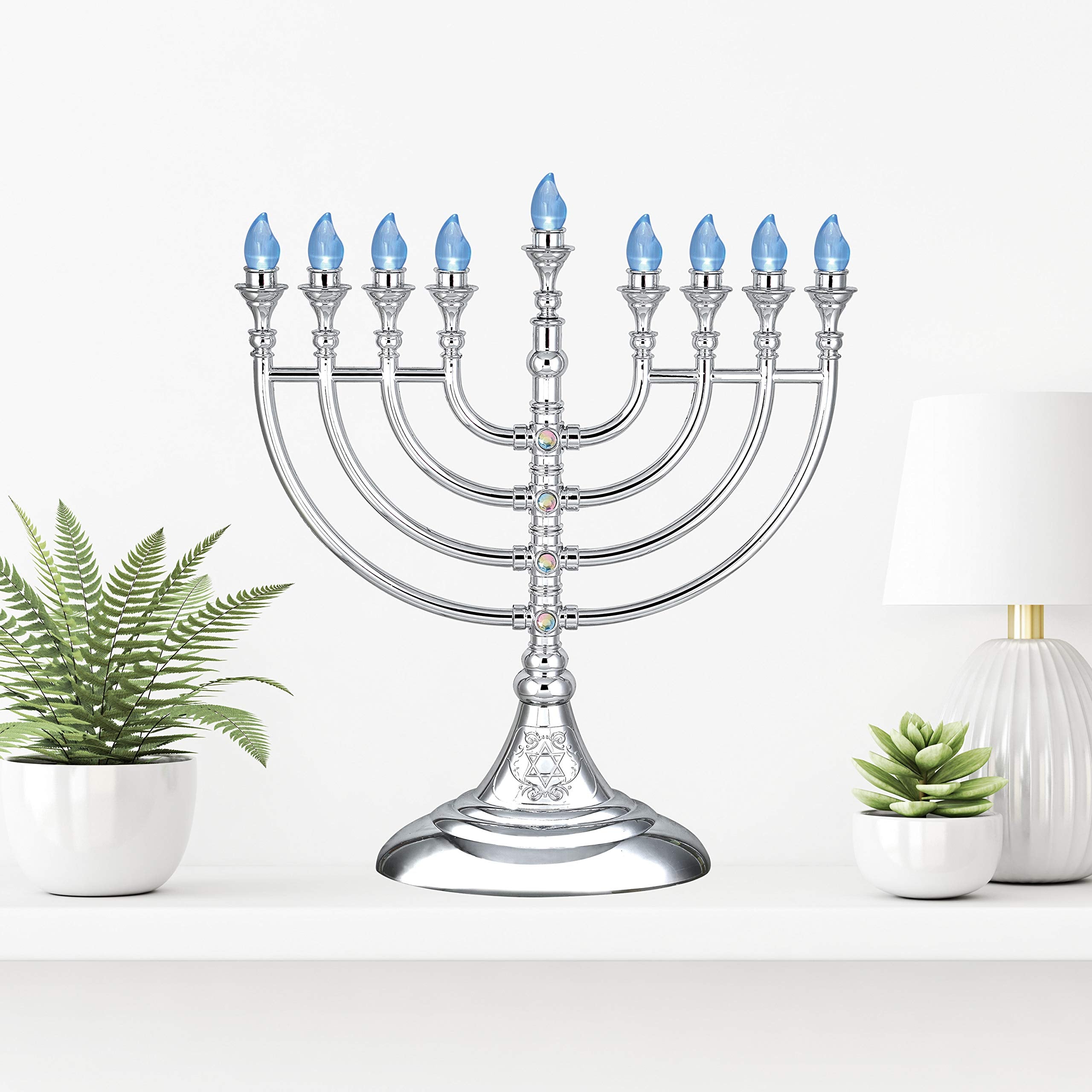 Aviv Judaica menorah styled on table with seasonal decor creating festive atmosphere