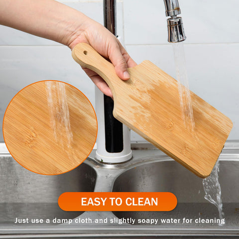 AWIZOM board next to hand to show compact 11x5 inch size benefit