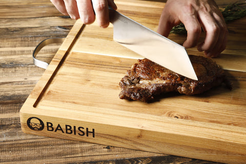 Babish Clef in use chopping vegetables for efficient prep