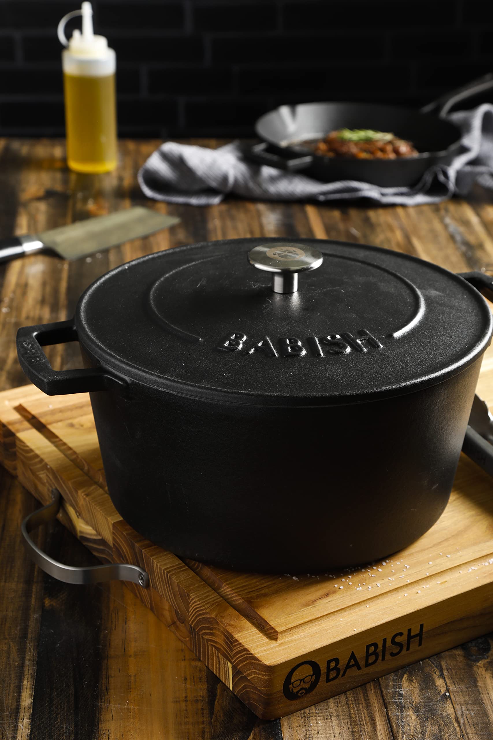 Babish Dutch oven served on table in cozy kitchen scene, attractive presentation benefit