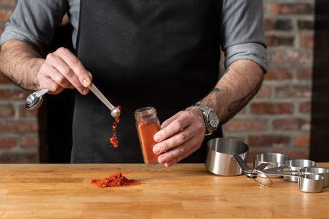 Babish cups and spoons next to common kitchen items showing size comparison
