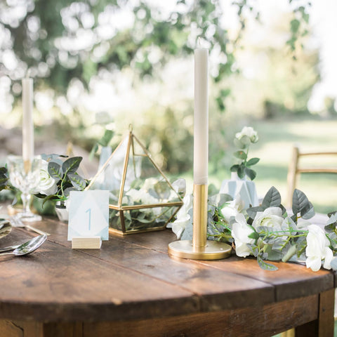 Bacucine garland wrapped with string lights creating warm ambiance benefit