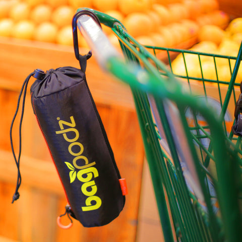 BagPodz pod clipped to cart for quick access and hands-free convenience