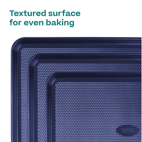 Baker's Secret nonstick surface being wiped clean to show easy release benefit