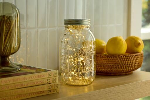 Ball quart jar next to ruler showing scale and useful 32oz capacity benefit