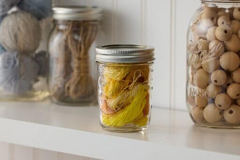 Ball jar held in hand showing half-pint scale for portion control benefit