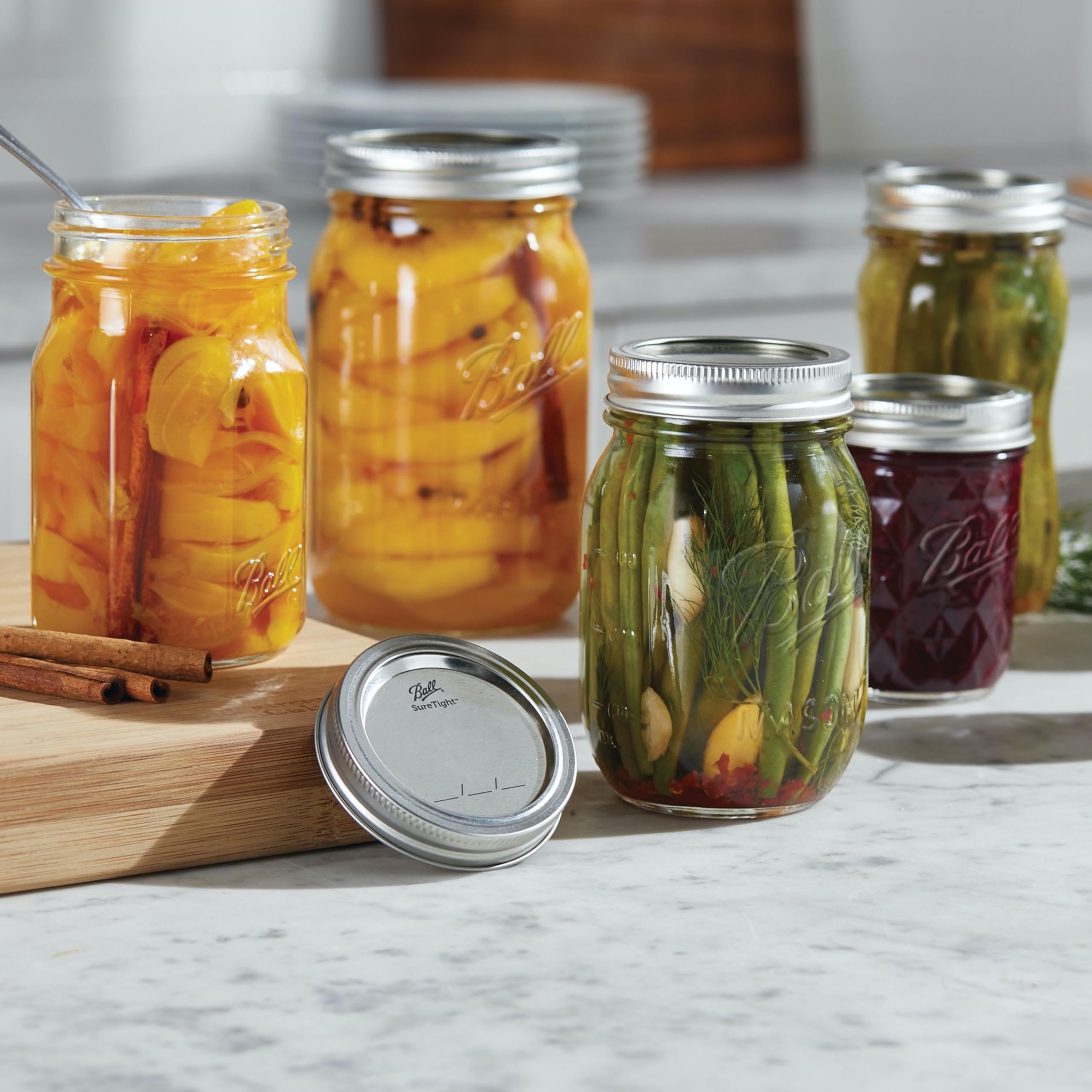 Ball jars on canning rack showing readiness for processing