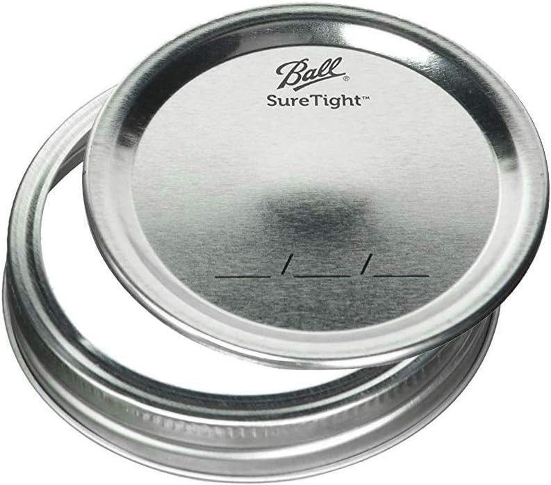 Ball lid beside ruler showing wide-mouth size for easy filling and measuring