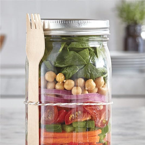 Ball lids staged on kitchen workbench for bulk canning preparation