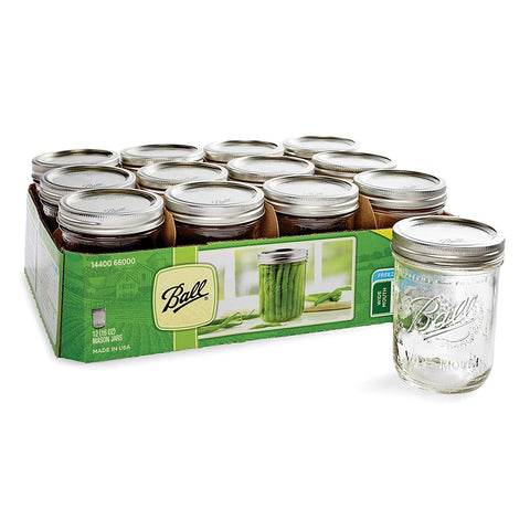 Ball jars on a crafting table illustrating decorating and gifting