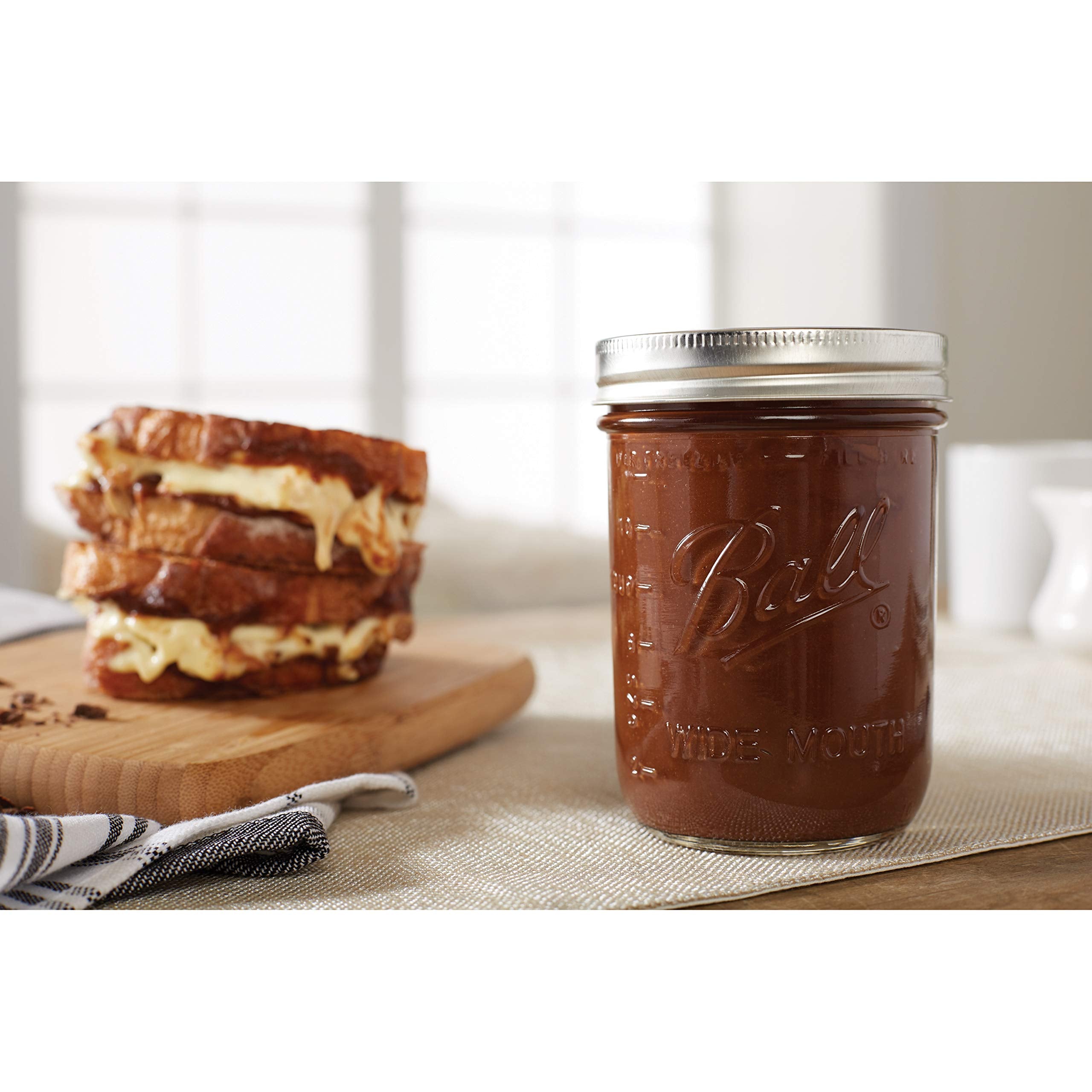 Hand holding Ball pint jar showing scale and convenient portioning