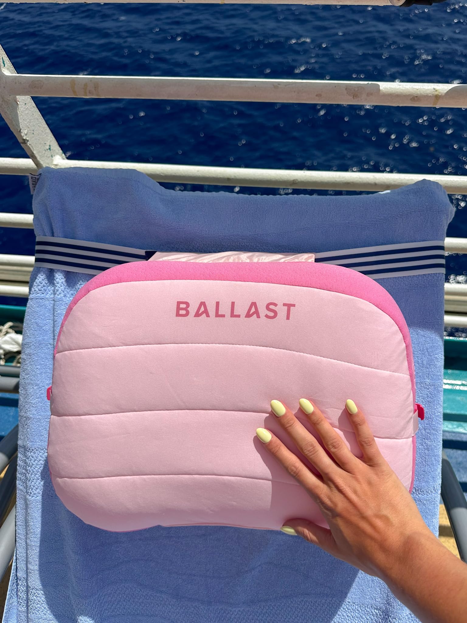 Ballast in use on sand with user lounging showing stability in wind