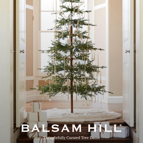 Balsam Hill gifts arranged on skirt illustrating decorative presentation benefits
