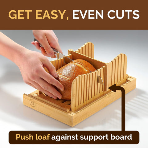Bambüsi open slicer holding a homemade loaf for even slicing