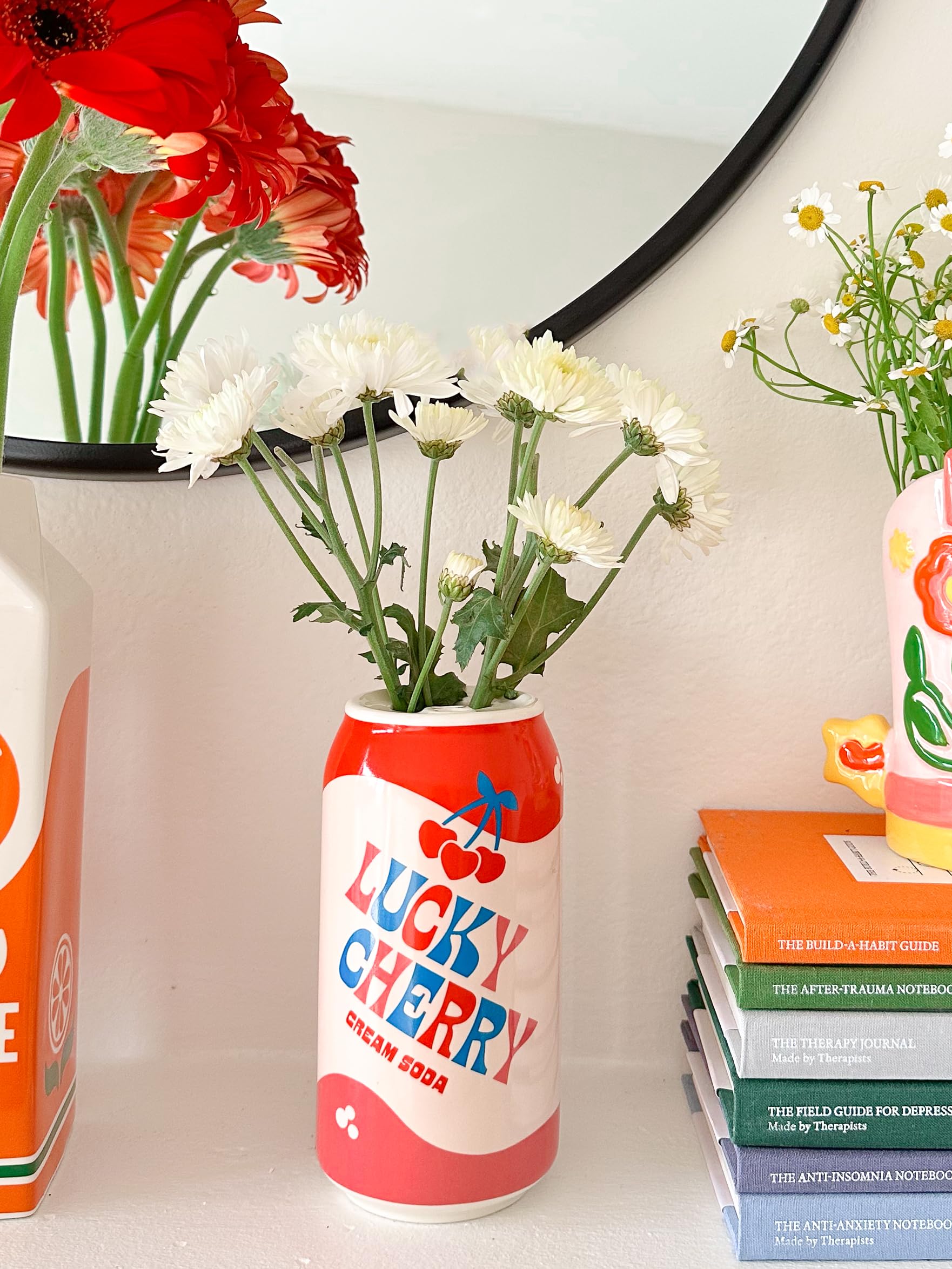 ban.do on a shelf in a living space adding whimsical accent and style benefit