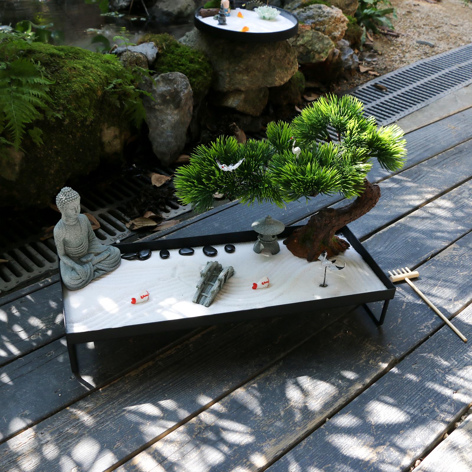 BangBangDa in-use on home office desk with person raking sand, reduces stress