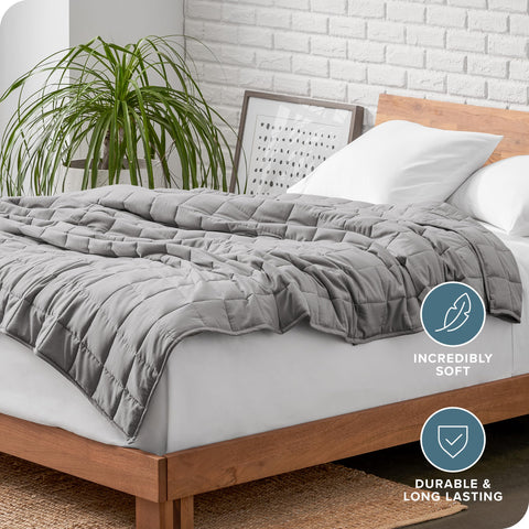 Bare Home folded blanket on couch illustrating convenient throw use and living room comfort