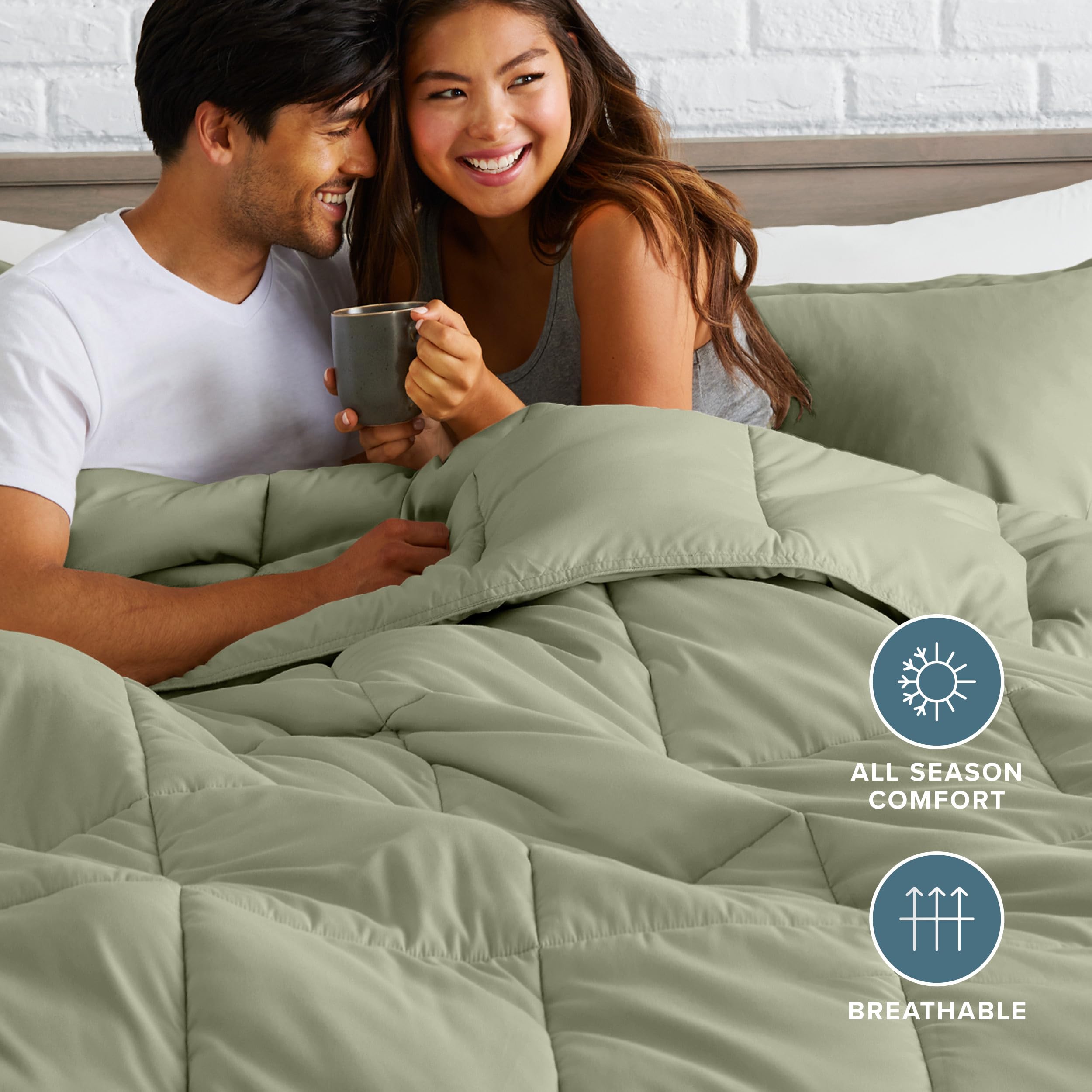 Bare Home comforter styled on a made bed demonstrating elegant sage color and layered look