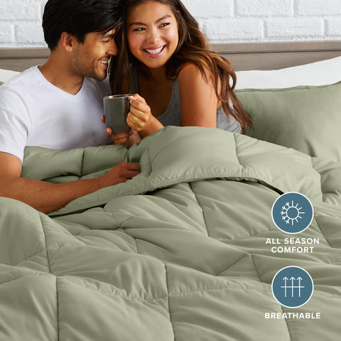 Bare Home comforter styled on a made bed demonstrating elegant sage color and layered look