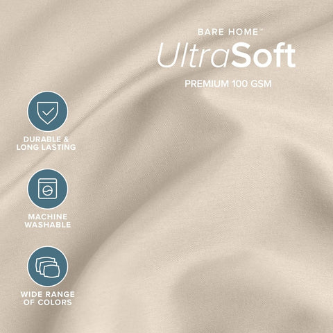 Bare Home flat sheet draped on bed demonstrating full XL coverage and neat look
