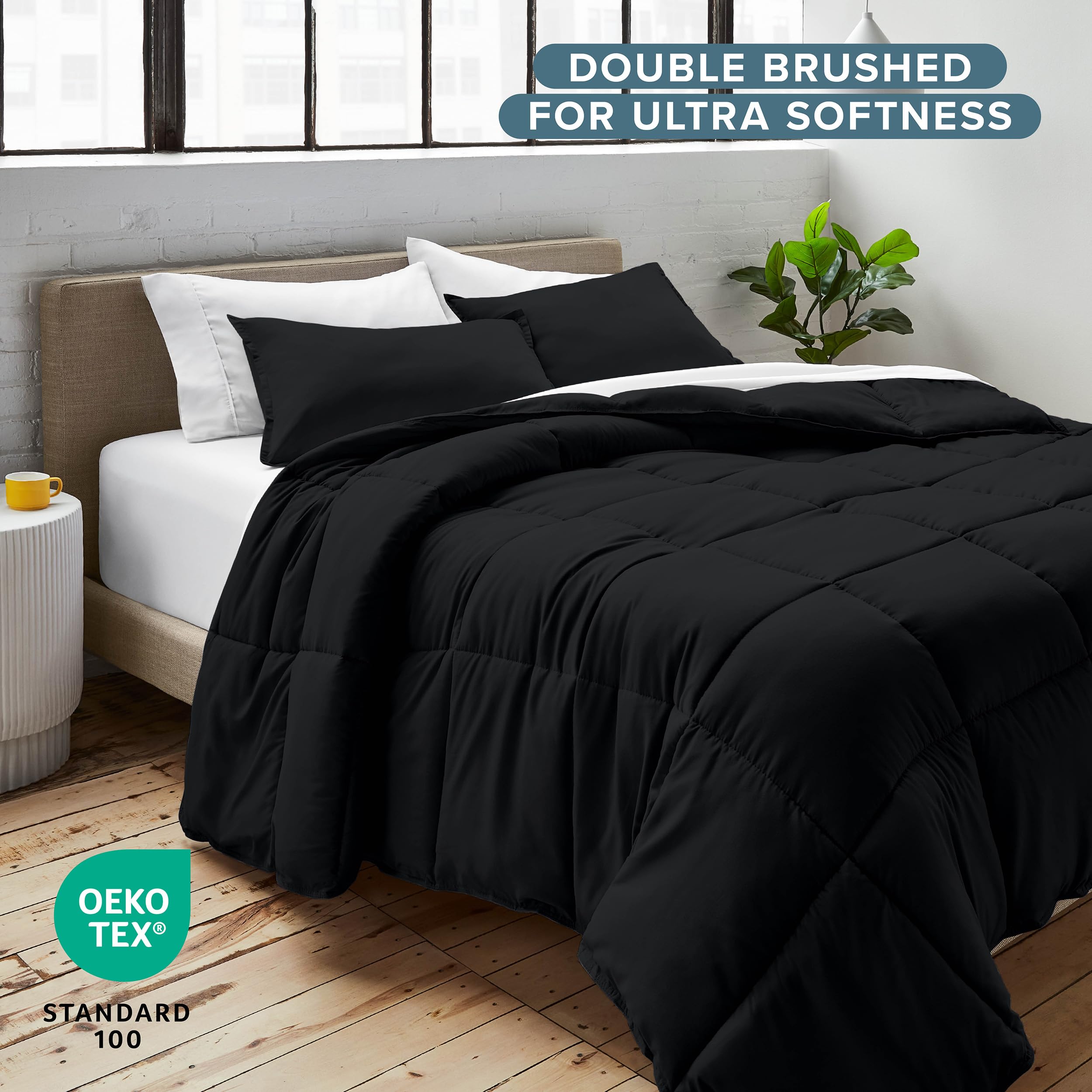 Bare Home comforter folded beside washer illustrating easy machine-wash convenience