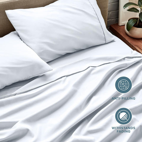 Bare Home styled bed lifestyle photo showing minimalist white bedding and restful appeal
