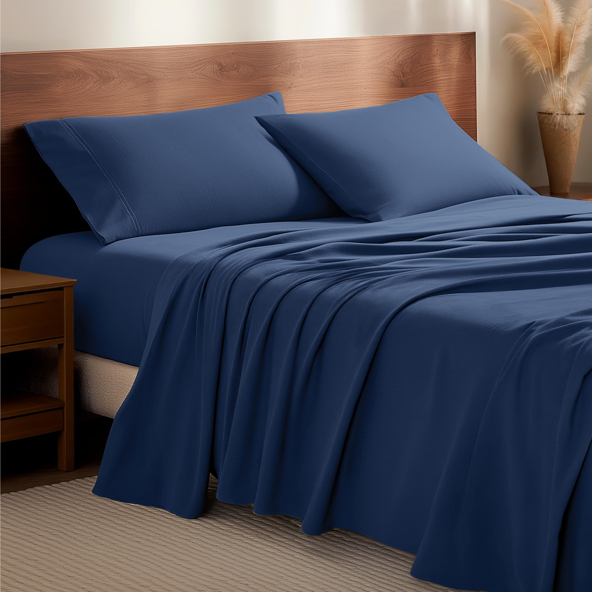 Bare Home front view of dark blue king flannel sheet set showcasing cozy look and neat packaging