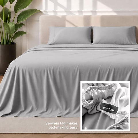 Bare Home styled bedroom with light grey sheets demonstrating neutral aesthetic and calm sleep space