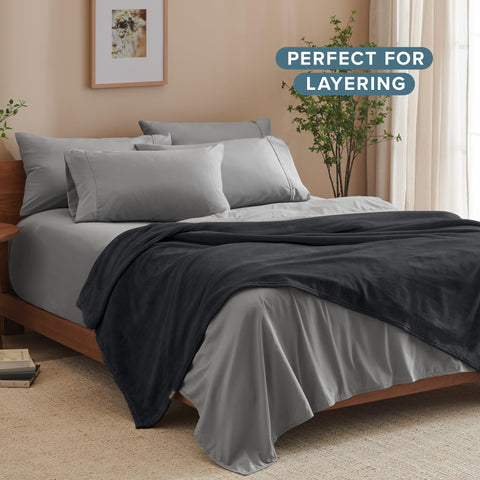 Bare Home blanket rolled in travel bag demonstrating portability and warmth