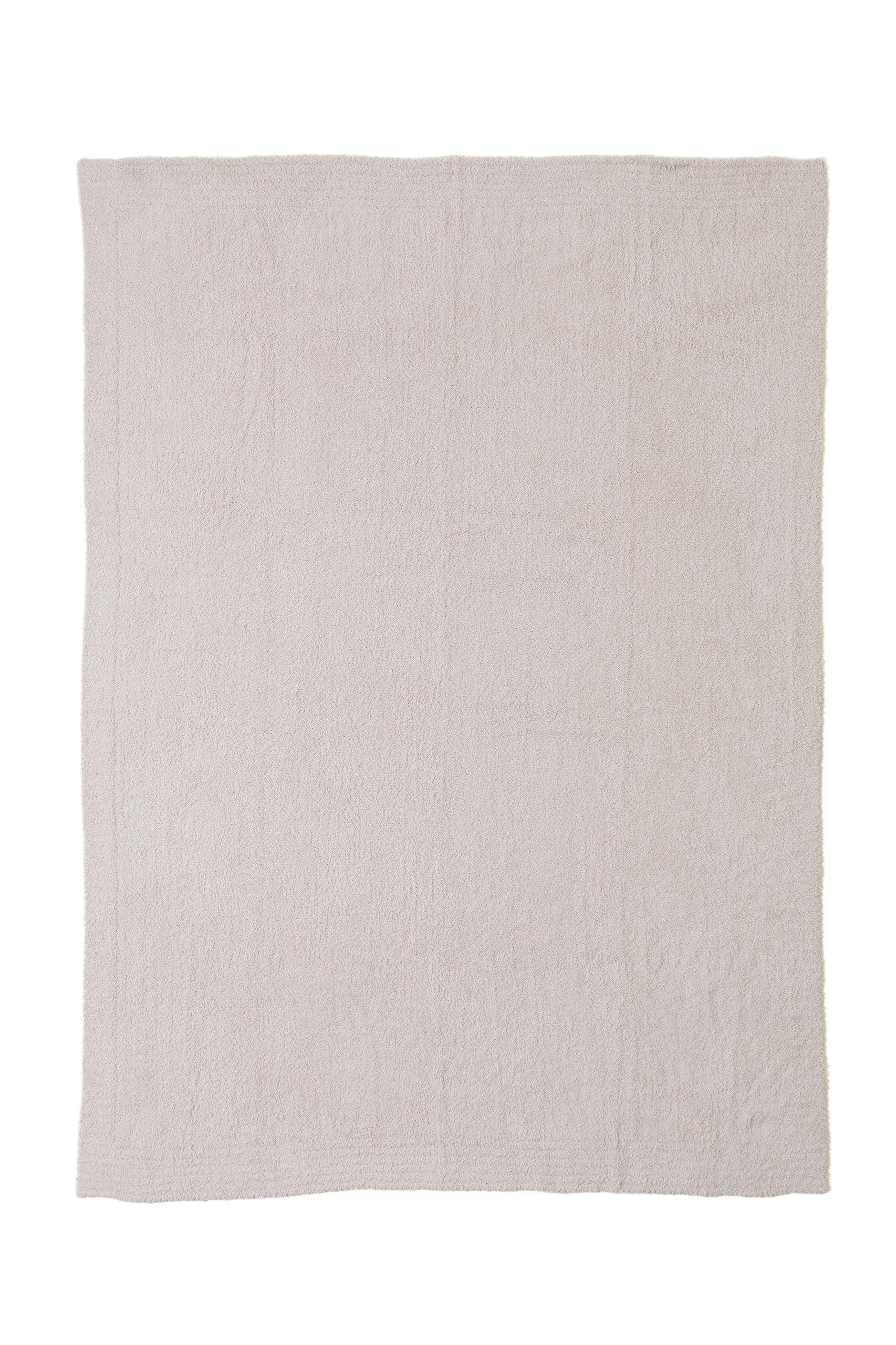 Barefoot Dreams at foot of bed highlighting size and layering potential for bedroom warmth