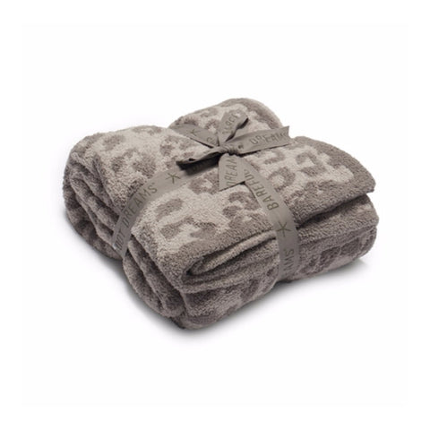 Barefoot Dreams throw front display showing leopard linen warm gray pattern and gifting bow, stylish accent