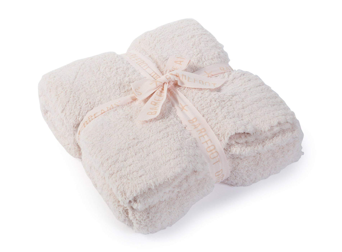 Barefoot Dreams CozyChic throw folded on sofa for instant cozy style