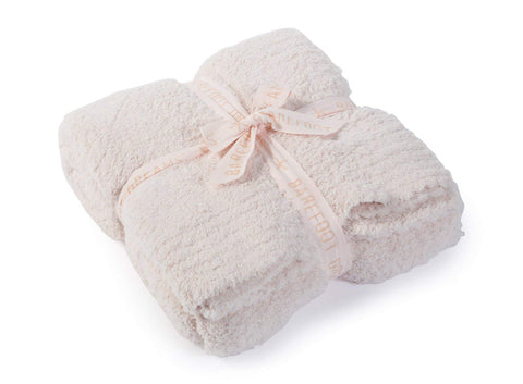 Barefoot Dreams CozyChic throw folded on sofa for instant cozy style
