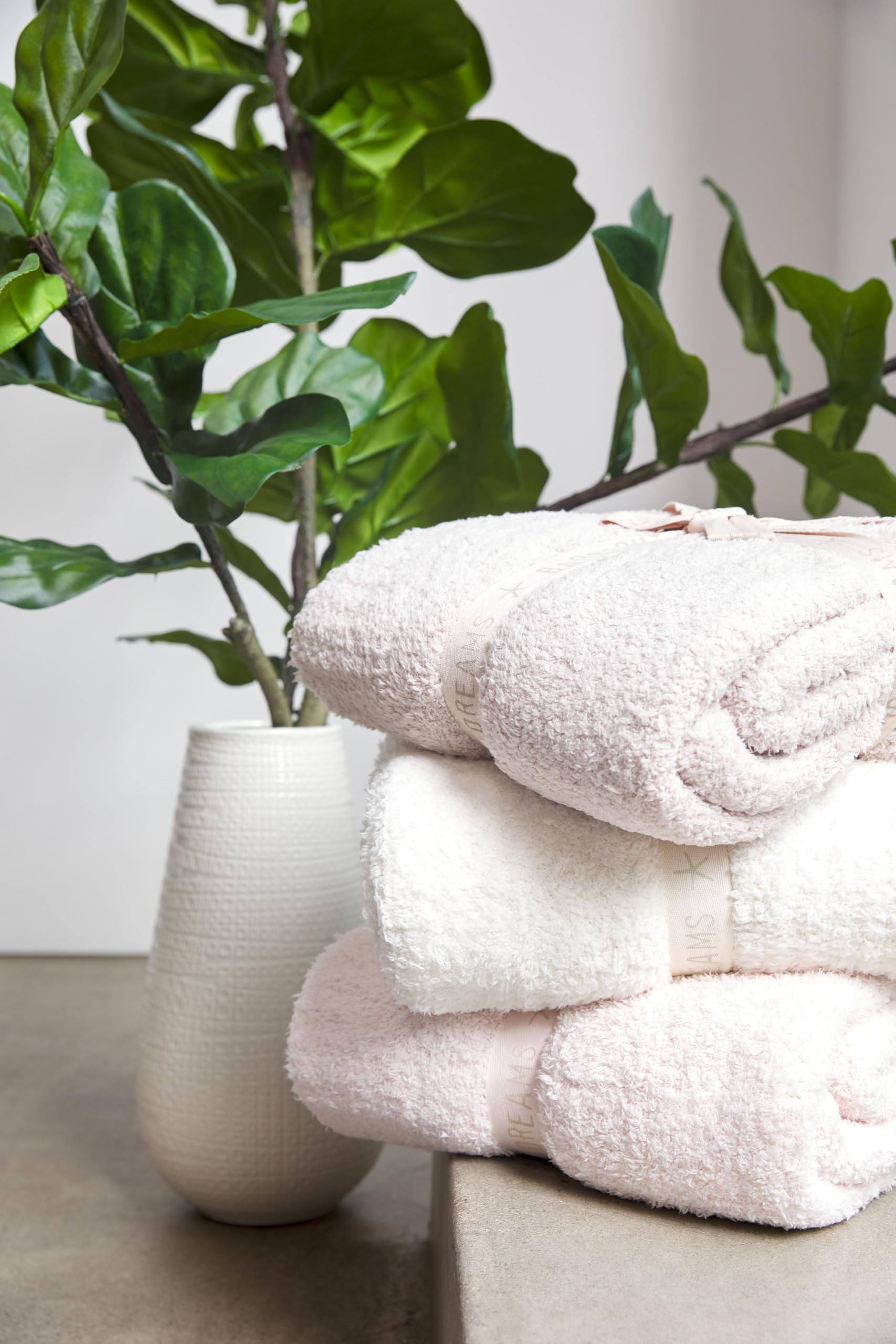 Barefoot Dreams folded on shelf demonstrating compact storage and neat display convenience
