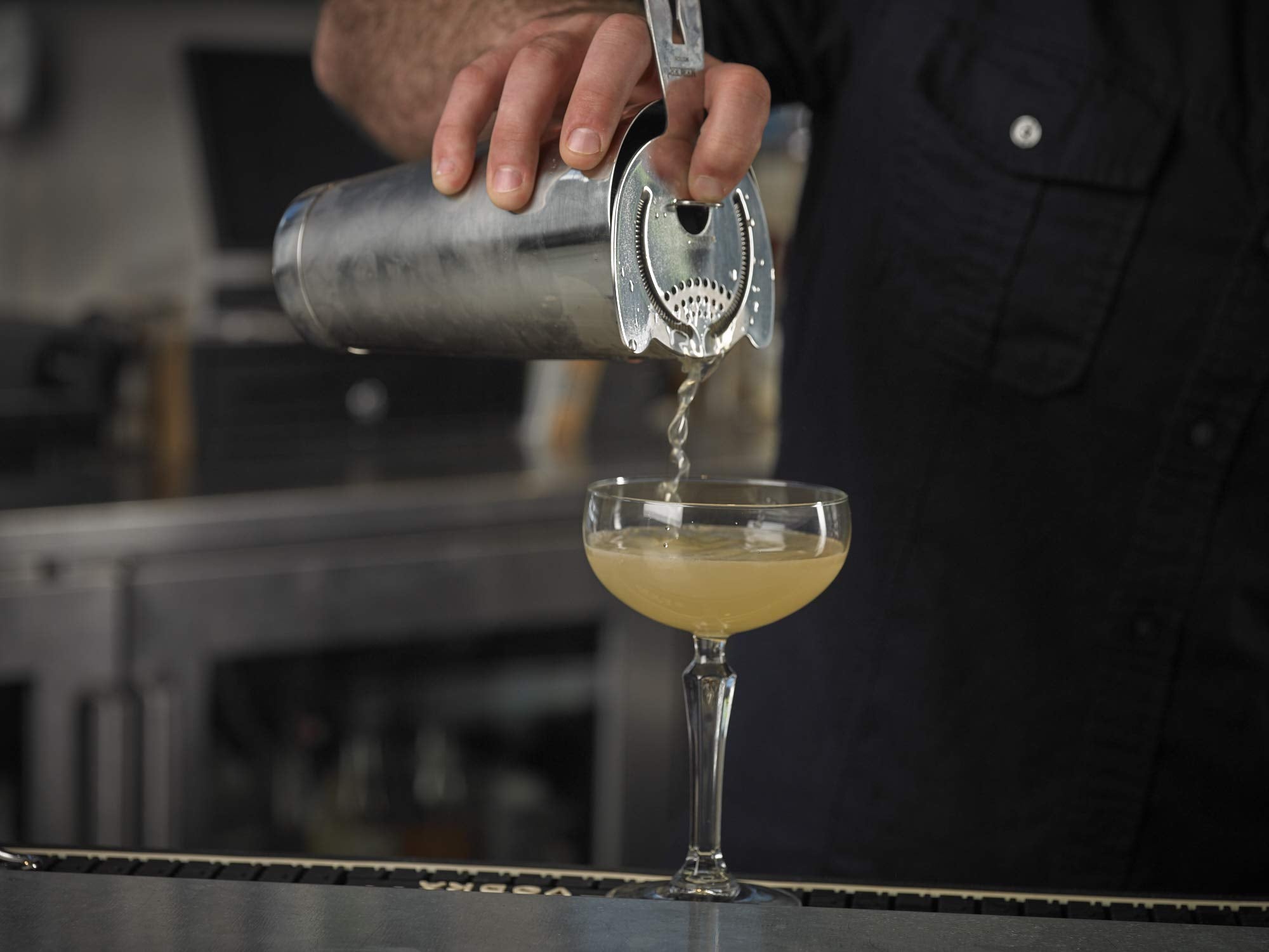 Barfly shaker held in hand demonstrating balanced weight and comfortable grip